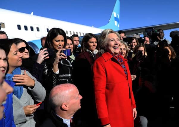 Hillary Clinton puts on a positive face on last day of US campaign. Picture: Getty Images