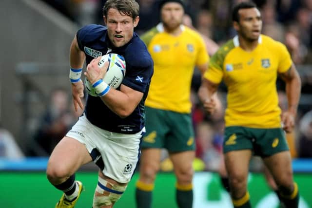 Scotland's Peter Horne breaks through the Australian defence to score a try during the 2015 Rugby World Cup quarter-final. Picture: Jane Barlow.