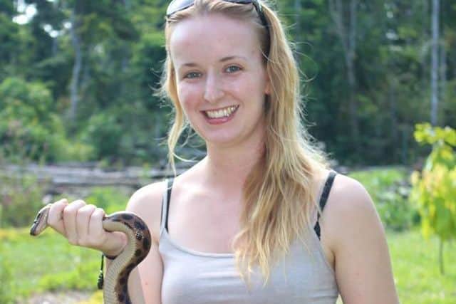 Holly holding a Rainbow Boa. Picture: Contributed