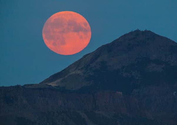 The Supermoon rises over Edinburgh, Scotland on the night of a total Lunar eclipse. Picture Toby Williams