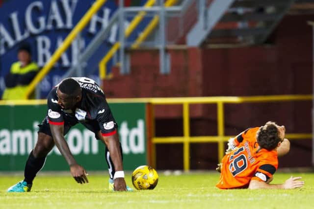 Dundee United's Tony Andreu lies on the turf after the tackle by Nat Wedderburn which saw the Dunfermline midfielder sent off. Picture: Roddy Scott/SNS