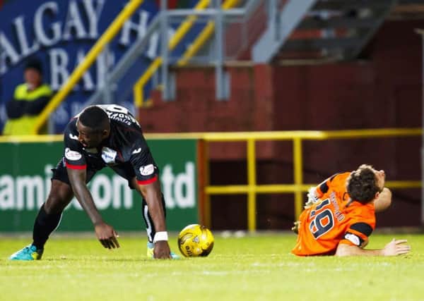 Dundee United's Tony Andreu lies on the turf after the tackle by Nat Wedderburn which saw the Dunfermline midfielder sent off. Picture: Roddy Scott/SNS
