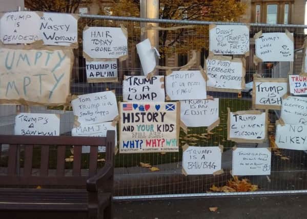 The signs were posted on railings in George Square. Picture: Twitter/ItsDelbert