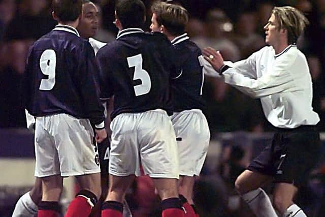 Neil McCann, Callum Davidson and Billy Dodds close in on Englands Paul Ince. Picture: SNS