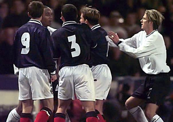 Neil McCann, Callum Davidson and Billy Dodds close in on Englands Paul Ince. Picture: SNS