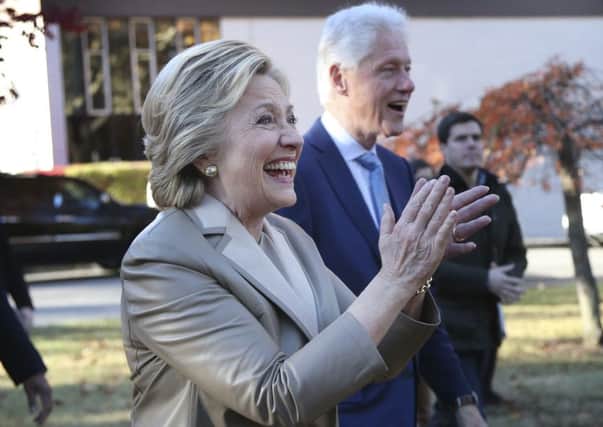 Hillary Clinton, and her husband former President Bill Clinton, greet supporters after voting in Chappaqua, New York. Picture: AP