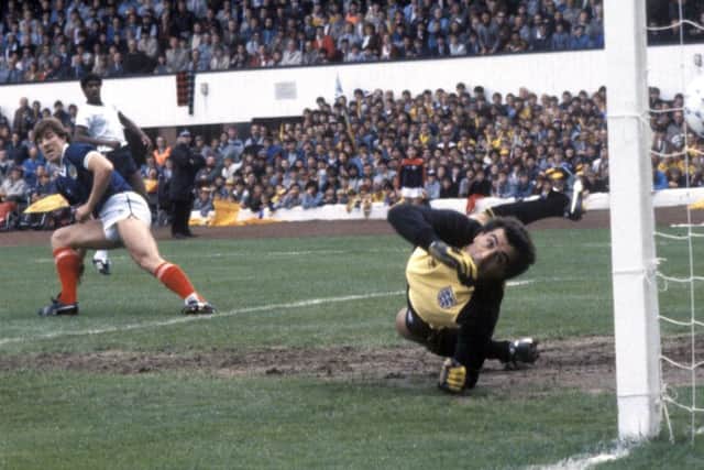 Mark McGhee (left) beats Peter Shilton to open the scoring for Scotland against England at Hampden in 1984. Picture: SNS