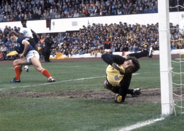Mark McGhee (left) beats Peter Shilton to open the scoring for Scotland against England at Hampden in 1984. Picture: SNS