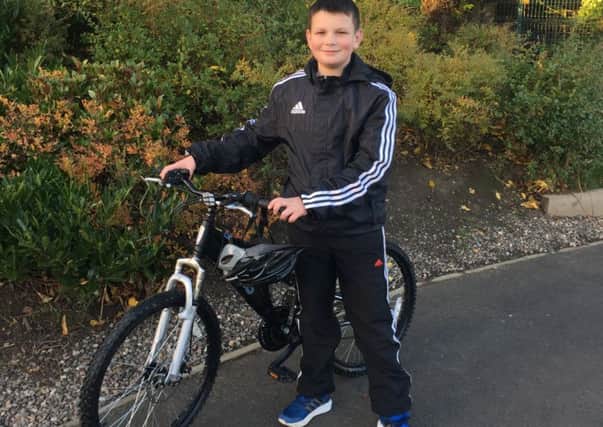 Logan Thomson will cycle across the Forth Road Bridge 14 times in aid of Poppyscotland. Picture: Contributed