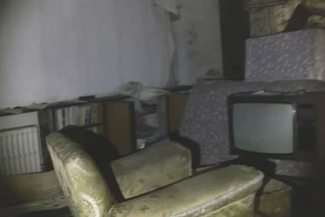 The inside of the mansion is filled with old furniture like TVs, couches and book shelves. Picture: Youtube