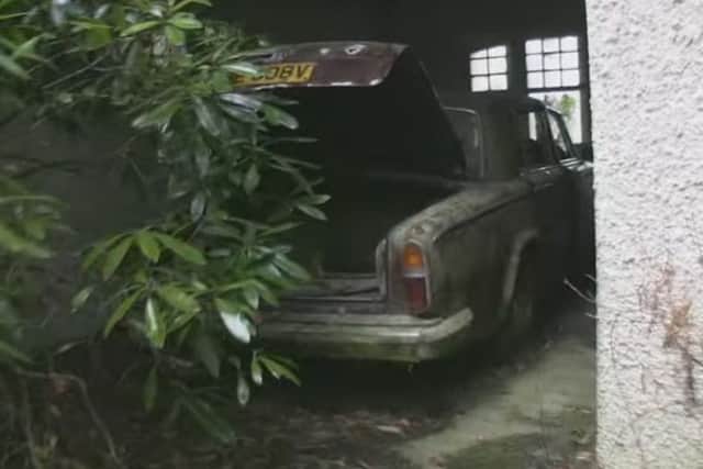 A rusting Rolls Royce sits in the garage. Picture: Youtube