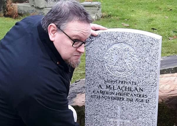 Craig Menzies with the headstone which has been re-instated at the grave of his great grandfather in Glasgow's Southern Necropolis Cemetery. Picture: Commonwealth War Graves Commission/PA Wire