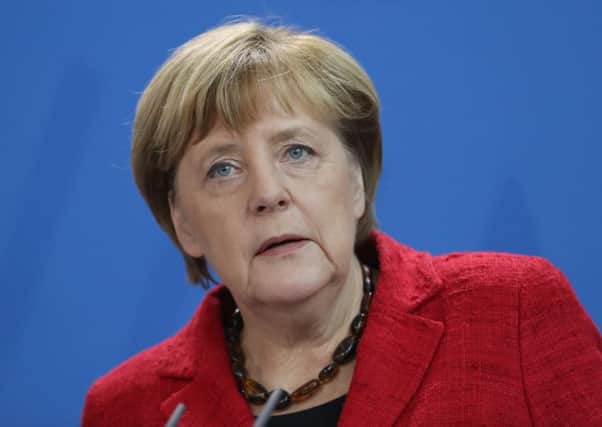 German Chancellor Angela Merkel gives a statement to the media following the victory by U.S. Republican candidate Donald Trump in U.S. presidential elections. (Photo by Sean Gallup/Getty Images)
