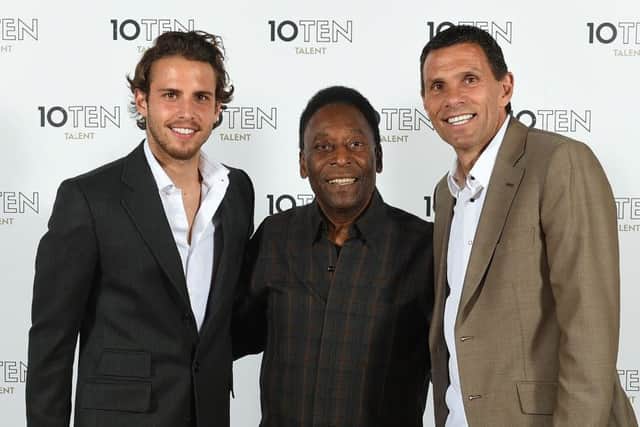 Diego, left, with dad Gus Poyet, right, meeting Pele at an event last year. Picture: Getty