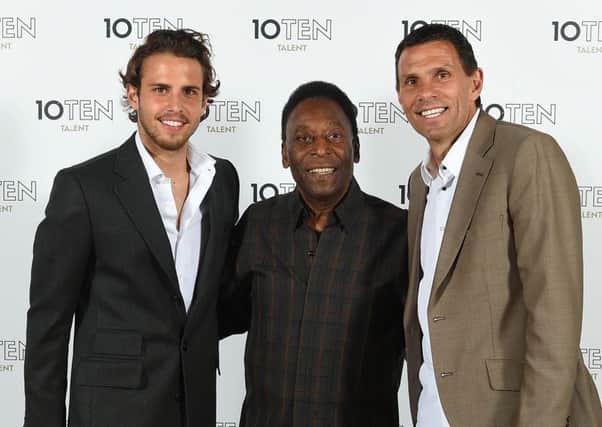 Diego, left, with dad Gus Poyet, right, meeting Pele at an event last year. Picture: Getty