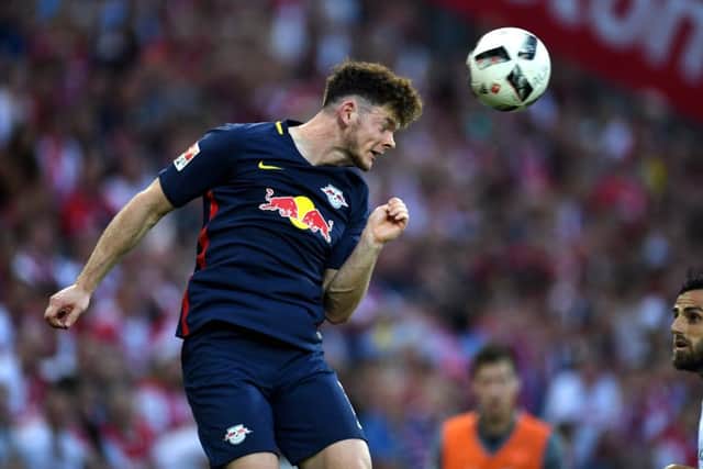 LeipzigÂ´s midfielder Oliver Burke vies for the ball during the German first division Bundesliga football match of 1 FC Cologne vs RB Leipzig in Cologne, western Germany, on September 25, 2016. / AFP / PATRIK STOLLARZ / RESTRICTIONS: DURING MATCH TIME: DFL RULES TO LIMIT THE ONLINE USAGE TO 15 PICTURES PER MATCH AND FORBID IMAGE SEQUENCES TO SIMULATE VIDEO. == RESTRICTED TO EDITORIAL USE == FOR FURTHER QUERIES PLEASE CONTACT DFL DIRECTLY AT + 49 69 650050
        (Photo credit should read PATRIK STOLLARZ/AFP/Getty Images)