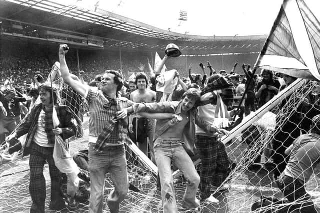 Exuberant Scotland fans on the Wembley pitch after the 2-1 victory in 1977. Picture: Denis Straughan