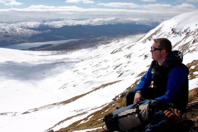 Mountain guide Stuart Johnston on Meall Corranaich, looking towards Loch Tay PIC: Roger Cox