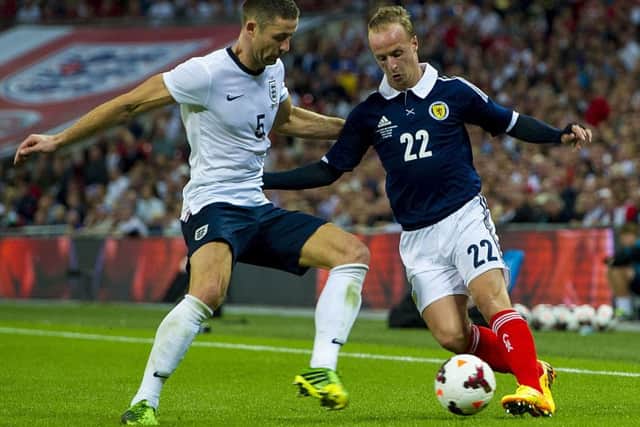 Leigh Griffiths takes on Gary Cahill when the sides last met in 2013. Picture: SNS.
