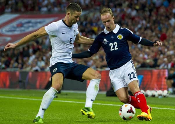 Leigh Griffiths takes on Gary Cahill when the sides last met in 2013. Picture: SNS.