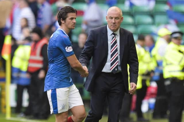 Joey Barton shakes hands with Rangers manager Mark Warburton at the end of the 5-1 defeat by Celtic, the midfielder's final game for the Ibrox club. Picture: SNS