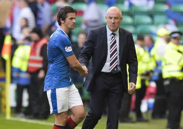 Joey Barton shakes hands with Rangers manager Mark Warburton at the end of the 5-1 defeat by Celtic, the midfielder's final game for the Ibrox club. Picture: SNS