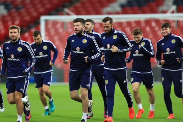The Scotland squad warms up during a training session at Wembley. Picture: Tim Goode/PA Wire