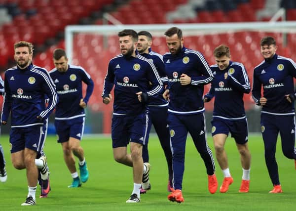 The Scotland squad warms up during a training session at Wembley. Picture: Tim Goode/PA Wire
