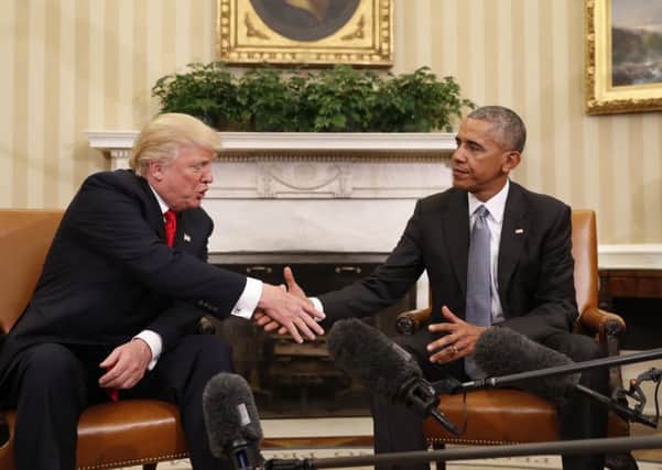 President Barack Obama shakes hands with President-elect Donald Trump in the Oval Office of the White House. AP Photo: Pablo Martinez Monsivais