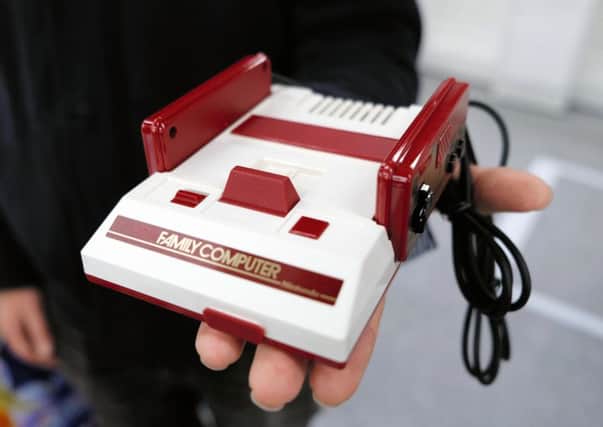 Ahead of the launch of its Switch console, Nintendo has scored a success with the remake of its 1980s Family Computer. Picture: The Asahi Shimbun via Getty Images