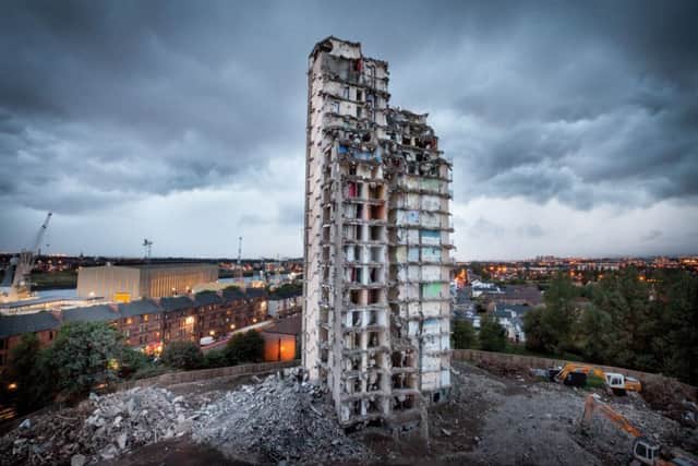A high rise in Plean Street, Glasgow, is brought down in 2010. Photographer Chris Leslie documented many of the demolitions in the city for his book, Disappearing Glasgow