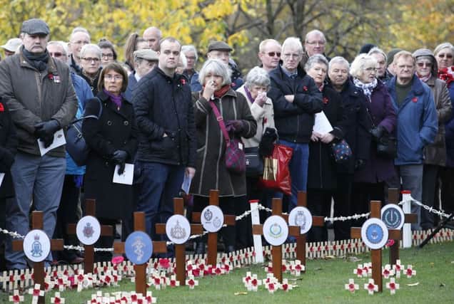 Two minutes' silence is observed in Princes Street Gardens, Edinburgh, to mark Armistice Day. Picture: PA