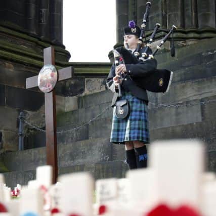 A piper plays in the  Remembrance Garden in Edinburgh's Princes Street Gardens. Picture: PA
