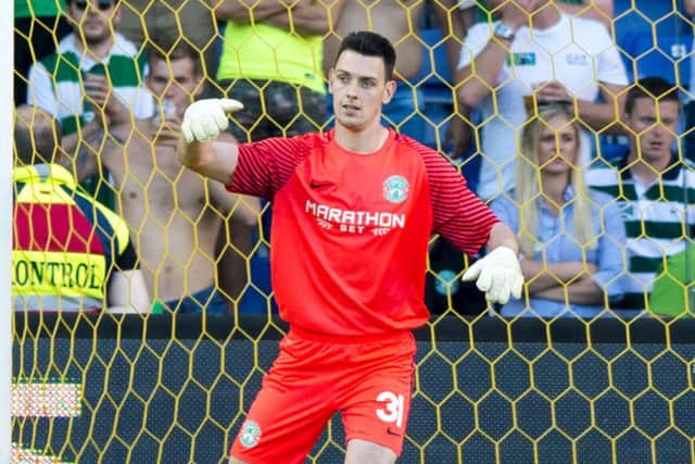 Goalkeeper Ross Laidlaw has the confidence of Paul Hanlon as he deputises for Ofir Marciano. Picture: SNS.