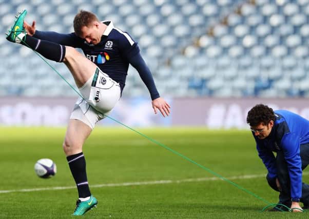 Stuart Hogg goes through his kicking drills during the captain's run at BT Murrayfield. Picture: Ian MacNicol/Getty Images