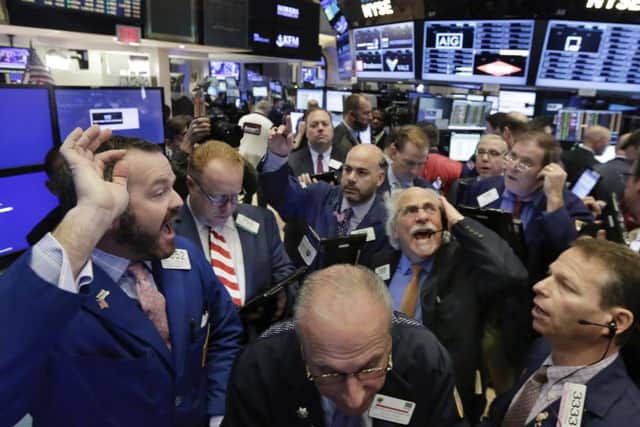 Lively trading on the New York Stock Exchange on Wednesday following the surprise victory of Donald Trump in the US presidential election. Picture: Richard Drew/AP