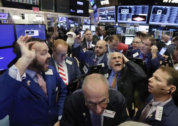 Lively trading on the New York Stock Exchange on Wednesday following the surprise victory of Donald Trump in the US presidential election. Picture: Richard Drew/AP