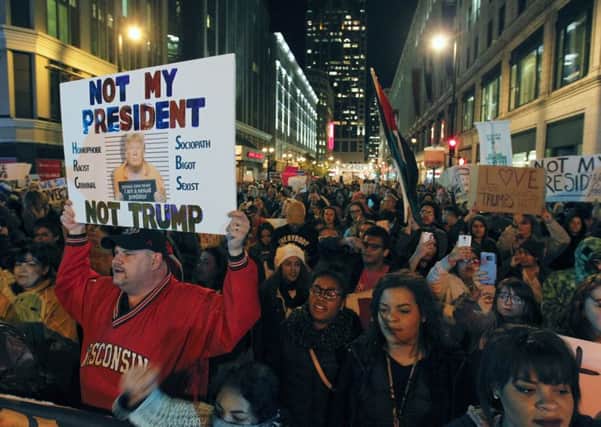 Anti-Trump protesters march on Wisconsin Avenue in Milwaukee . Picture: Pat A. Robinson/Milwaukee Journal-Sentinel via AP