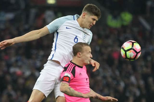 John Stones and Leigh Griffiths went head to head. Picture: AFP/Getty