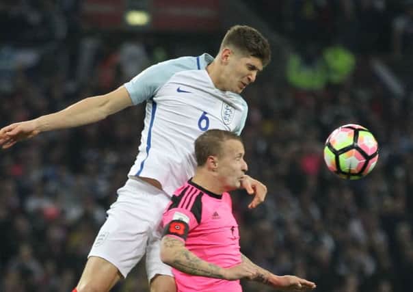 John Stones and Leigh Griffiths went head to head. Picture: AFP/Getty