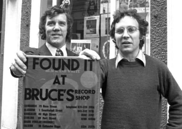 Owners Brian Findlay and Bruce Findlay with their shop's distinctive red carrier bag for LPs, outside Bruce's record shop in Rose Street, Edinburgh, 1972. Picture: Denis Straughan