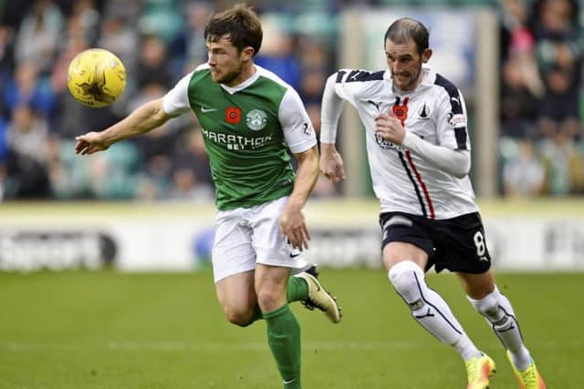 Lewis Stevenson of Hibs escapes the attention of Falkirks Mark Kerr during Saturdays draw. Picture: SNS.