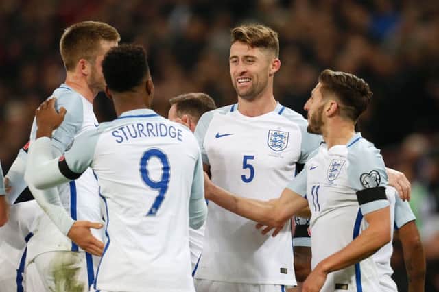 England's players celebrate after Gary Cahill (centre) scores the third goal. Picture: AFP/Getty
