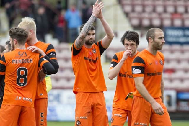 Dundee United's Mark Durnan, centre, scored the only goal of the match in his side's victory over Dunfermline. Picture: Craig Foy/SNS