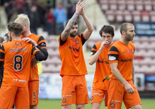 Dundee United's Mark Durnan, centre, scored the only goal of the match in his side's victory over Dunfermline. Picture: Craig Foy/SNS