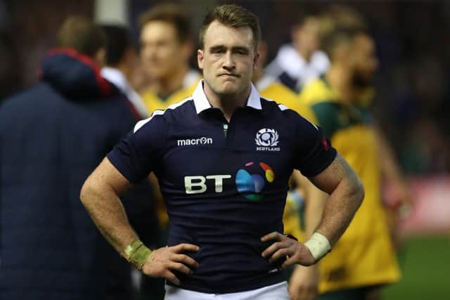 Stuart Hogg looks on as Australian players celebrate another one-point win. Picture: Ian MacNicol/Getty Images