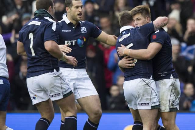 Scotland's Huw Jones (right) celebrates scoring his second try of the game versus Australia at Murrayfield. Picture: Gary Hutchison/SNS