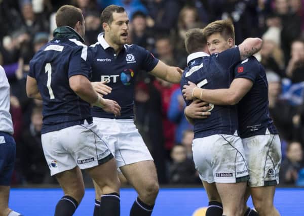 Scotland's Huw Jones (right) celebrates scoring his second try of the game versus Australia at Murrayfield. Picture: Gary Hutchison/SNS