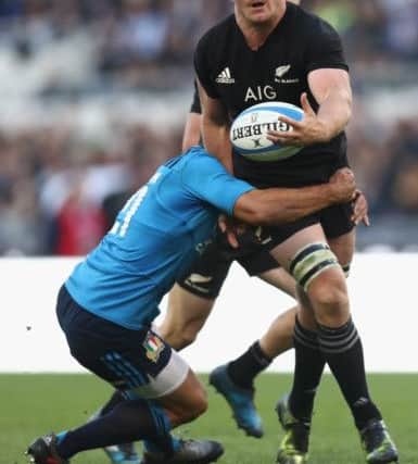 Sam Cane of the All Blacks is tackled during the international rugby match between New Zealand and Italy at Stadio Olimpico in Rome. Picture: Phil Walter/Getty