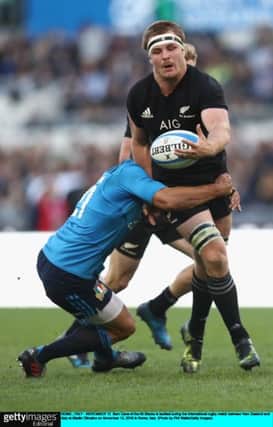 Sam Cane of the All Blacks is tackled during the international rugby match between New Zealand and Italy at Stadio Olimpico in Rome. Picture: Phil Walter/Getty